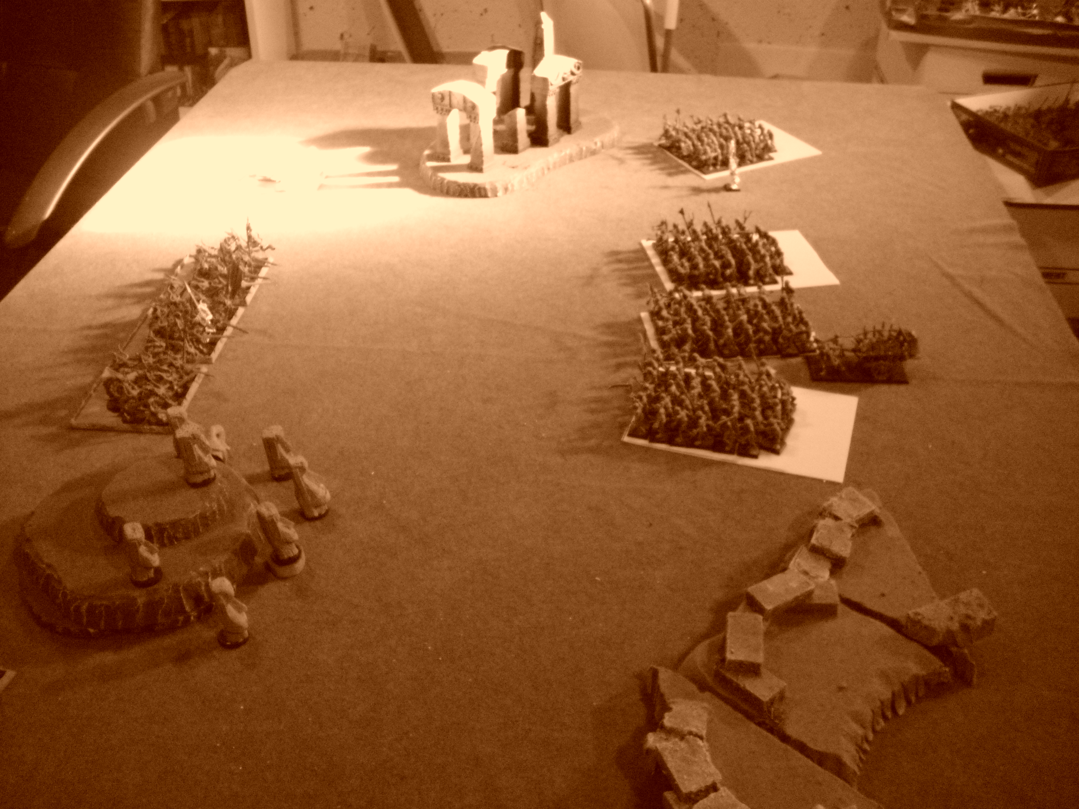 The sun casting long shadows on the battlefield